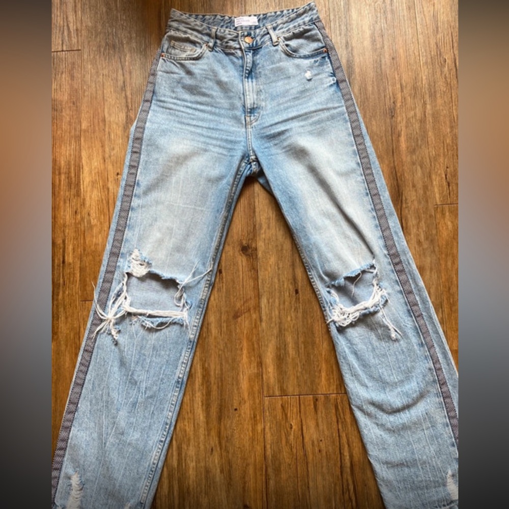 Straight ripped blue jeans